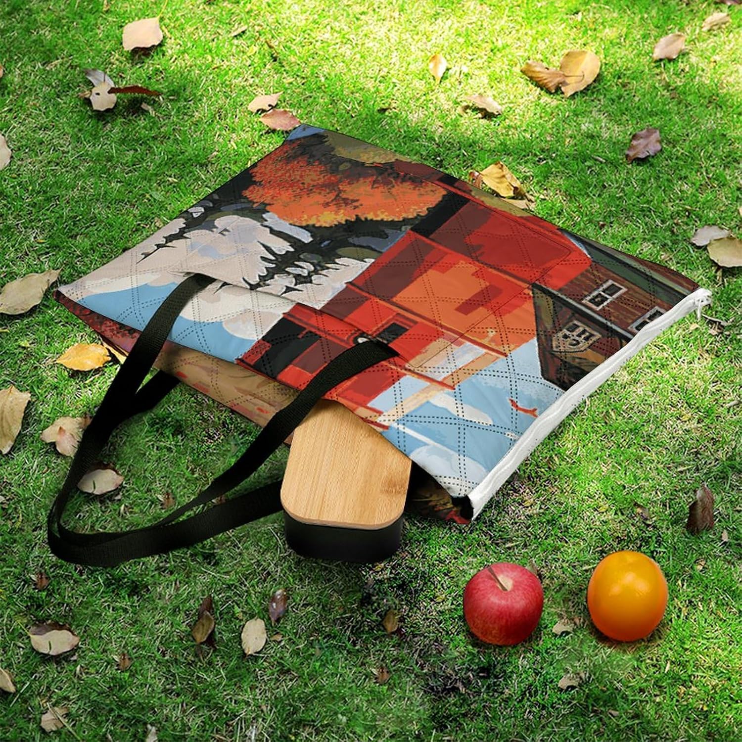 Picnic blanket with built-in carrying handle